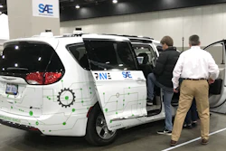 A person gets into a self-driving Chrysler Pacifica Hybrid Friday, April 5, 2019, in Detroit.