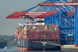 In this Monday, Oct. 15, 2018, file photo, a container ship is loaded at the harbor in Hamburg, Germany.