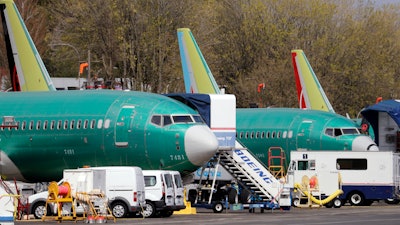 In this Monday, April 8, 2019, file photo, Boeing 737 Max 8 jets are parked at the airport adjacent to a Boeing Co. production facility in Renton, Wash.