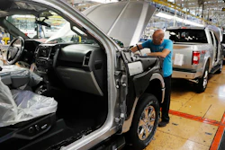 In this Sept. 27, 2018, file photo, a United Auto Workers assemblyman works on a 2018 Ford F-150 truck at the Ford Rouge assembly plant in Dearborn, Mich.