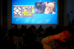 People watch the live broadcast of the SpaceIL spacecraft as it lost contact with Earth in Netanya, Thursday, April 11, 2019.