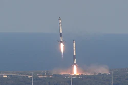 Eight minutes after liftoff, SpaceX lands two of the first-stage boosters side by side at the Kennedy Space Center in Cape Canaveral, Fla., Thursday, April 11, 2019.