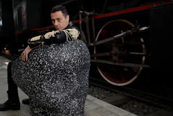 In this picture taken on Saturday, April 13, 2019, Italian designer Fabio Novembre poses on his 'Jolly Roger' chair at the National Museum of Science and Technology in Milan.