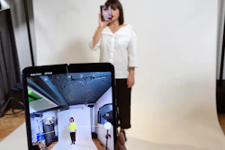 In this April 16, 2019, file photo, a model holds a Samsung Galaxy Fold smart phone to her face during a media preview event in London.