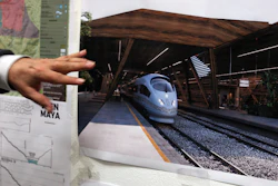 Rogelio Jiménez Pons, director of Fonatur, points to photos of a planned train through the Yucatan Peninsula during an interview in Mexico City, Monday, March 18, 2019.