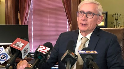 Wisconsin Gov. Tony Evers says he thinks it's 'unrealistic' for Foxconn Technology Group to employ 13,000 people in the state and he wants to renegotiate the contract during a news conference Wednesday, April 17, 2019, in Madison.