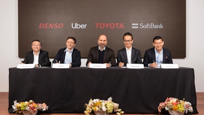 In this Thursday, April 18, 2019, photo, executives attend a press conference at Uber headquarters in San Francisco.