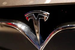 This Oct. 3, 2018, file photo shows a Tesla emblem at the Auto show in Paris.