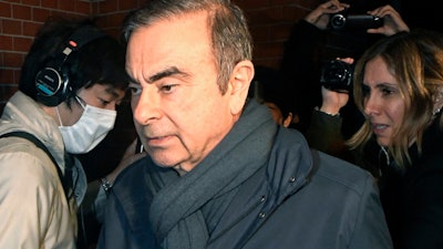 In this April 3, 2019, photo, former Nissan Chairman Carlos Ghosn returns to his residence in Tokyo.