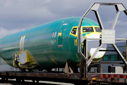 In this April 9, 2019, file photo, a Boeing 737 fuselage sits on a flatcar rail car at a rail yard in Seattle.
