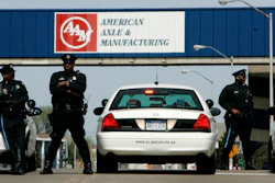 In this April 24, 2008, file photo, Detroit police officers block an entrance to the American Axle and Manufacturing Holdings plant in Detroit.