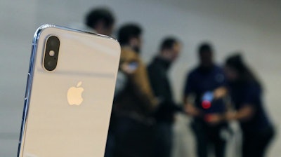 The Apple iPhone X sits on display at the Apple Michigan Avenue store in Chicago on Friday, Nov. 3, 2017.