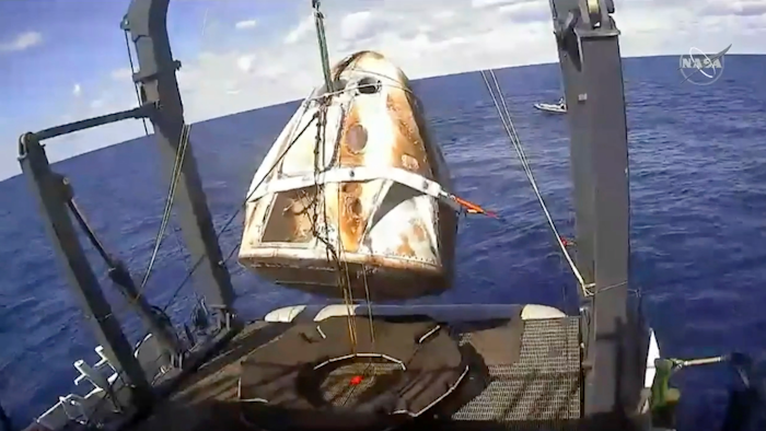 In this March 8, 2019, file image, the SpaceX Crew Dragon capsule is hoisted onto a ship off the Florida coast after it returned from a mission to the International Space Station.