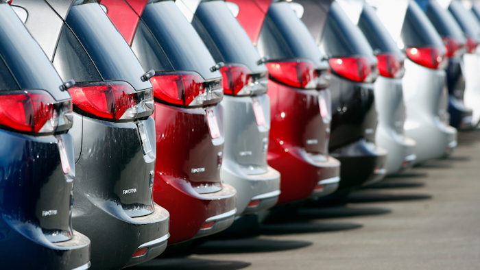 In this April 15, 2018, file photo, unsold 2018 Pacifica minivans sit on a Chrysler dealer's lot in the south Denver suburb of Englewood, Colo.