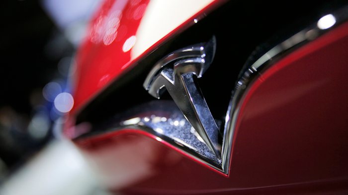 This Sept. 30, 2016, file photo shows the logo of the Tesla model S at the Paris Auto Show.