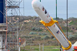 Orbital Sciences workers monitor NASA's Glory upper stack as a crane lifts it from a stationary rail for attachment to the Taurus XL rocket's Stage 0, Space Launch Complex 576-E, Vandenberg Air Force Base, Calif.