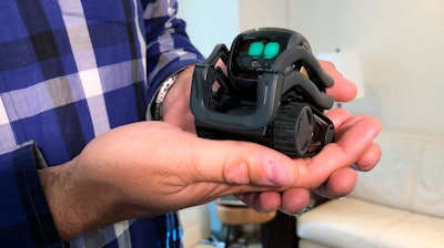 In this July 30, 2018, file photo, Anki Inc. CEO Boris Sofman holds Vector, the company's home robot, in New York.