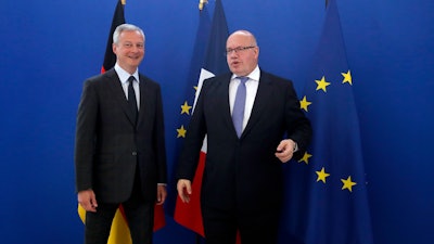 French Economy and Finance Minister Bruno Le Maire, left, and his German counterpart Peter Altmaier pose before a meeting in Paris, Thursday, May 2, 2019.