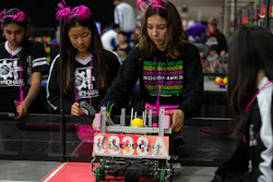 In this Thursday, April 25, 2019, photo, Amisha Chandra (far left), Elina Kim, Olivia Ramirez and Kristina Tu of the Orchard Hills, Calif., RoboHawks team practice at the VEX World Robotics Championships in Louisville, Ky.