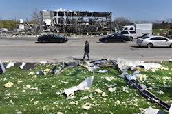 Debris is scattered across the street at the scene of an explosion at AB Specialty Silicones on Sunset Ave. and Northwestern Ave. on the border between Gurnee, Ill., and Waukegan.