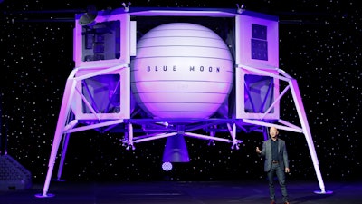 Jeff Bezos speaks in front of a model of Blue Origin's Blue Moon lunar lander, Thursday, May 9, 2019, in Washington.