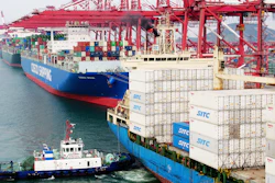 In this Wednesday, May 8, 2019, photo, a barge pushes a container ship to the dockyard in Qingdao in eastern China's Shandong province.
