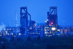 The furnace of German steelmaker Thyssenkrupp is illuminated in the evening twilight in Duisburg, Germany, Thursday, May 9, 2019.
