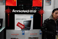 In this Jan 8, 2009, file photo, a vendor waits for customers at a computer shop selling Lenovo laptops in Beijing.