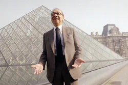 In this March 29, 1989, file photo, architect I.M. Pei laughs while posing for a portrait in front of the Louvre glass pyramid prior to its inauguration in Paris.