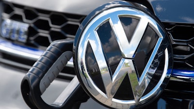 In this Tuesday, May 14, 2019, an e-Golf car at a charging station during a tour of the Volkswagen plant in Zwickau, Germany.