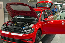 In this Tuesday, May 14, 2019, photo, workers complete Golf car bodies at the assembly line during a press tour of the Volkswagen plant in Zwickau, Germany.