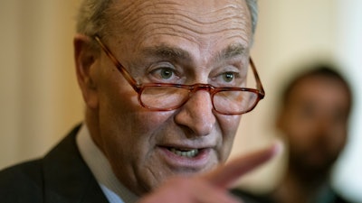 In this May 14, 2019 photo, Senate Minority Leader Chuck Schumer, D-N.Y., speaks to reporters at the Capitol in Washington.