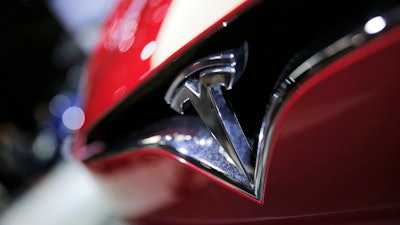 This Sept. 30, 2016, file photo shows the logo of the Tesla model S at the Paris Auto Show.