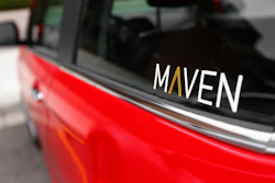This April 27, 2016, file photo shows the Maven logo on a General Motors car-sharing service automobile in Ann Arbor, Mich.