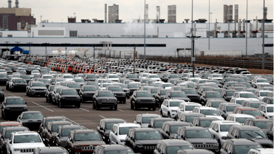 In this Feb. 26, 2019, file photo, Jeep vehicles are parked outside the Jefferson North Assembly Plant in Detroit.