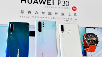 In this May 21, 2019, photo, Huwaei's new products are on display during a news conference in Tokyo.
