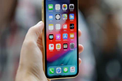 This Sept. 12, 2018, file photo shows an Apple iPhone XR on display at the Steve Jobs Theater in Cupertino, Calif.