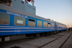 In this Monday, May 20, 2019 photo, new railroad passenger cars brought from China are inspected at their arrival in Havana.