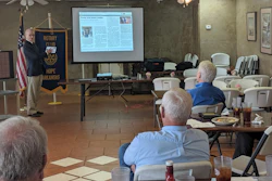In this on Thursday, May 23, 2019, photo, Walter Hussman Jr., publisher of the Arkansas Democrat-Gazette, explains to members of the Hope, Ark., Rotary Club how to access and use the paper's digital replica on an iPad.