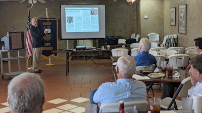 In this on Thursday, May 23, 2019, photo, Walter Hussman Jr., publisher of the Arkansas Democrat-Gazette, explains to members of the Hope, Ark., Rotary Club how to access and use the paper's digital replica on an iPad.