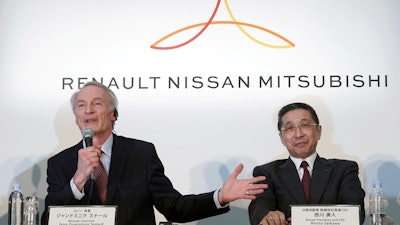 In this March 12, 2019, file photo, Renault Chairman Jean-Dominique Senard, left, speaks alongside Nissan CEO Hiroto Saikawa at a press conference in Yokohama.