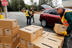 In this Monday, April 11, 2016, file photo, officials load boxes of bottled water in in Litchfield, N.H.