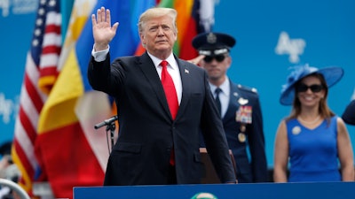 President Donald Trump waves as he takes the stage to speak at the U.S. Air Force Academy graduation, Thursday, May 30, 2019.