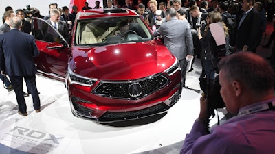 Members of the media photograph the Acura RDX Prototype at the North American International Auto Show, Monday, Jan. 15, 2018, in Detroit.