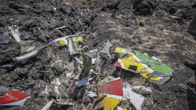 Wreckage lies at the scene of an Ethiopian Airlines flight that crashed shortly after takeoff at Hejere near Bishoftu in Ethiopia Sunday, March 10, 2019.