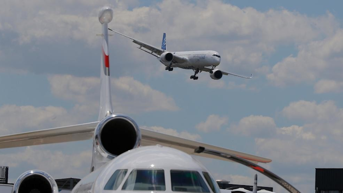 An Airbus A350-1000 performs a demonstration flight at the Paris Air Show, Monday, June 17, 2019.