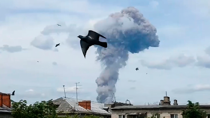 Smoke rises after an explosion in a plant manufacturing TNT explosive in Dzerzhinsk, Russia, Saturday, June 1, 2019.