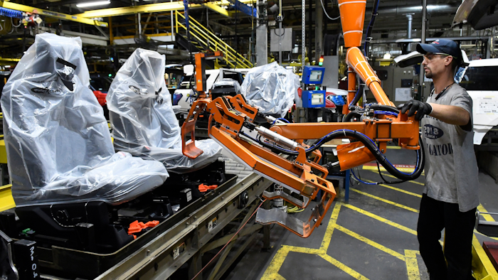 In this Oct. 27, 2017, photo, workers assemble trucks at the Ford Kentucky Truck Plant in Louisville.