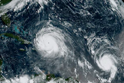 This Thursday, Sept. 7, 2017, satellite image shows the eye of Hurricane Irma, left, just north of the island of Hispaniola, with Hurricane Jose, right, in the Atlantic Ocean.