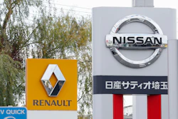 This Nov. 20, 2018, photo shows the logos of Nissan Motor Co. and Renault at car dealerships in Kawaguchi, Japan.